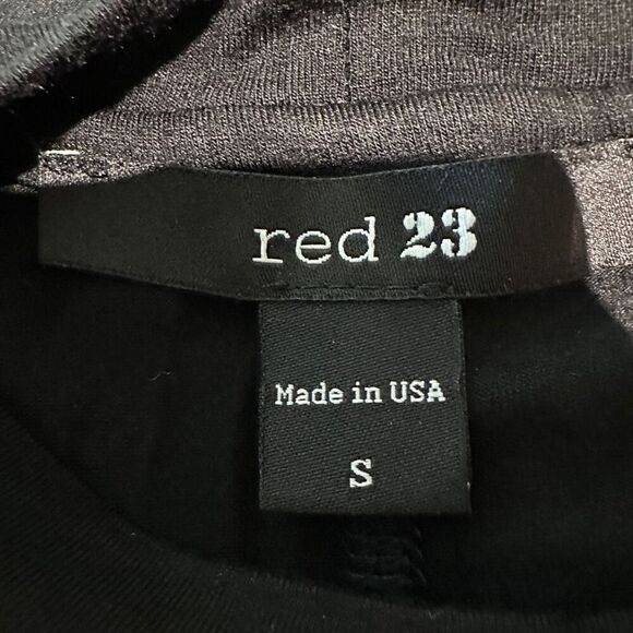 Black athletic tunic with leather sleeve accent - Picture 6 of 8